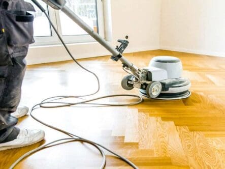 waxing hardwood floor with scrubbing machine.